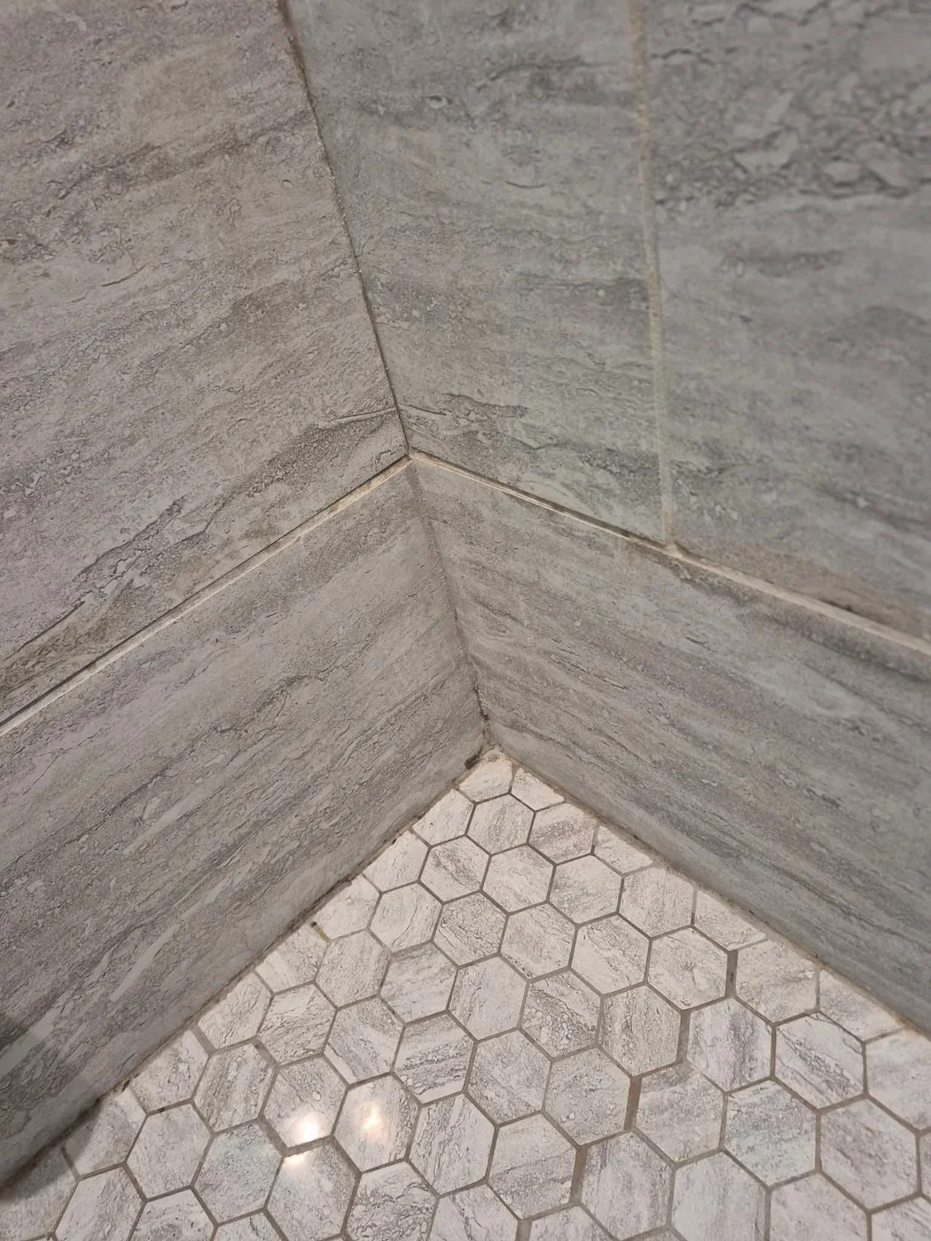 Hexagon-tile shower corner cleaned