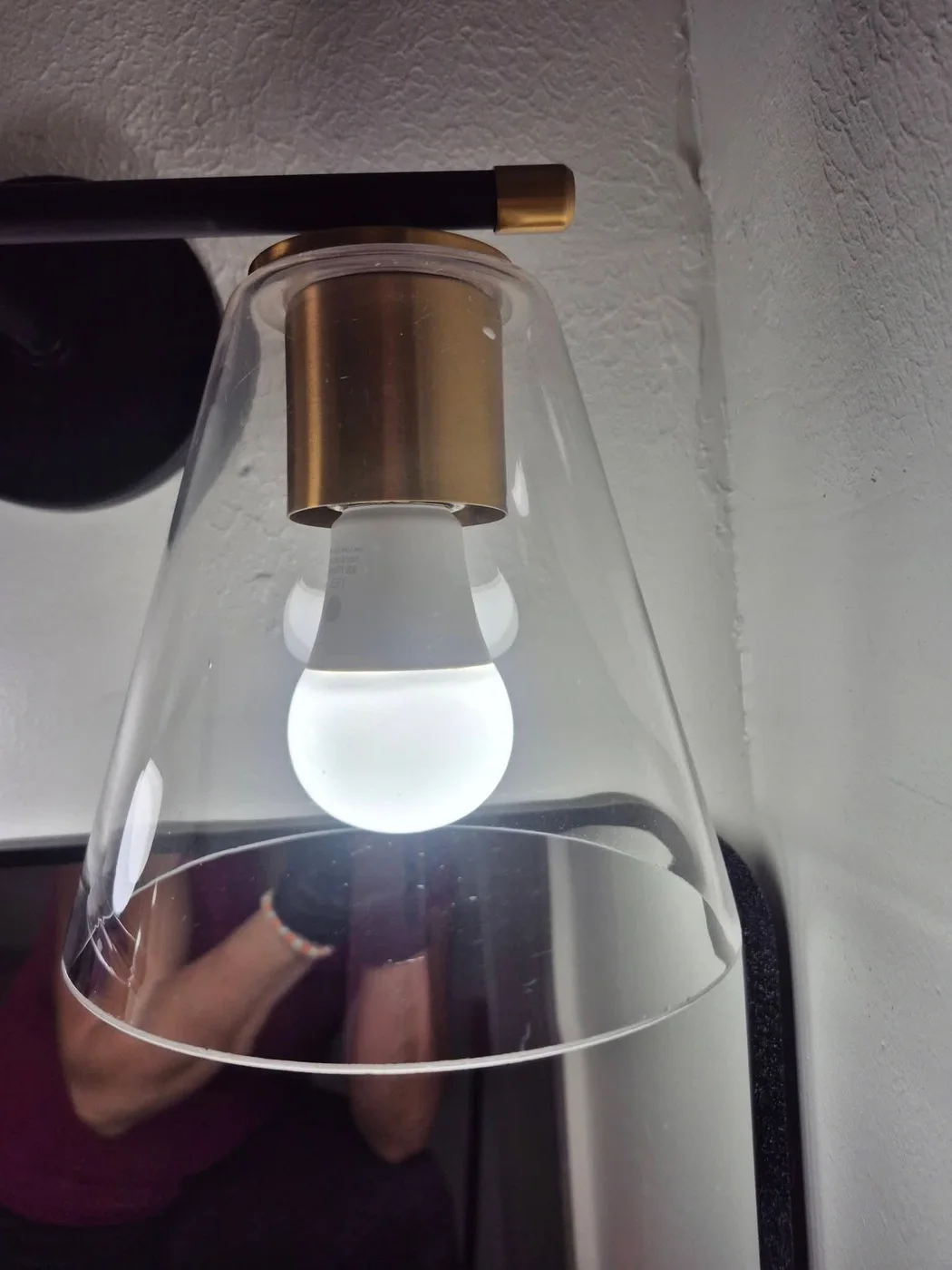 Light fixture cleaned, glowing bulb